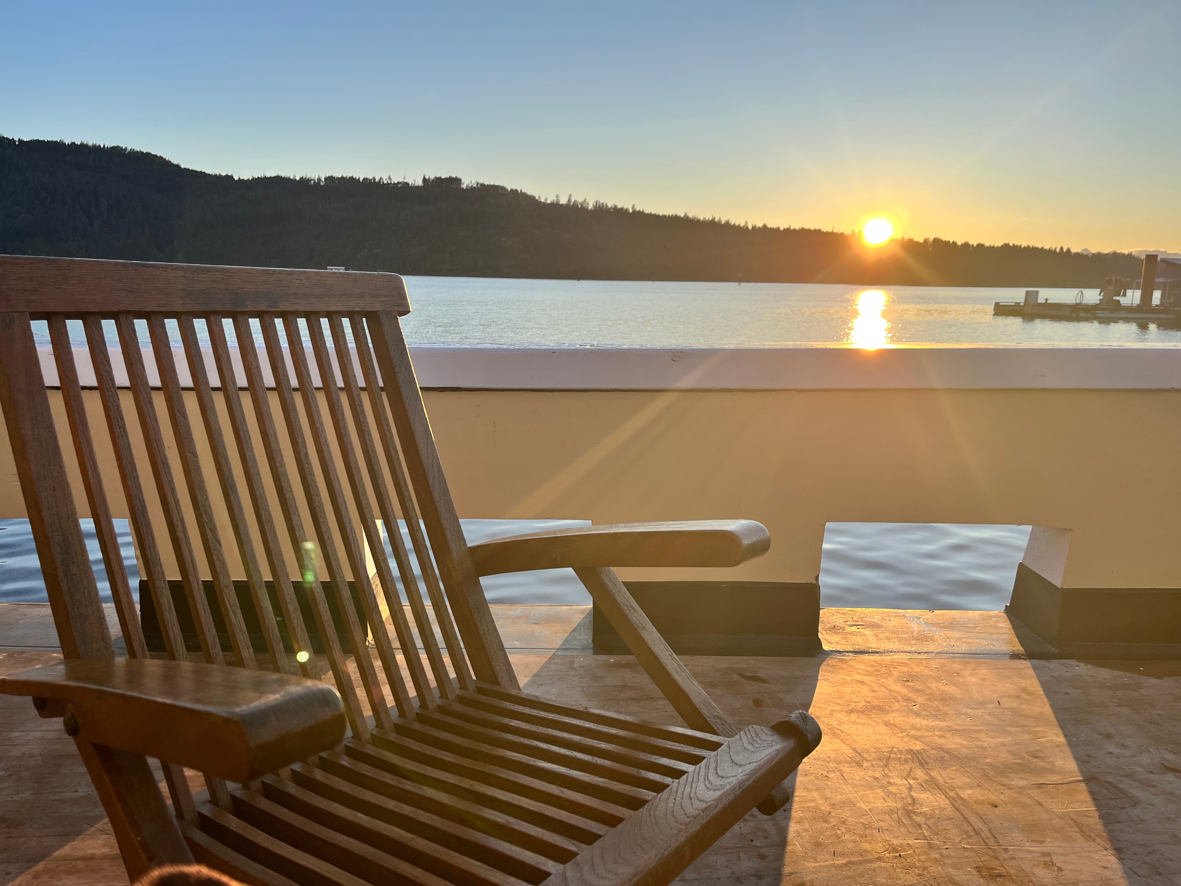 Teak deck chair at sunrise